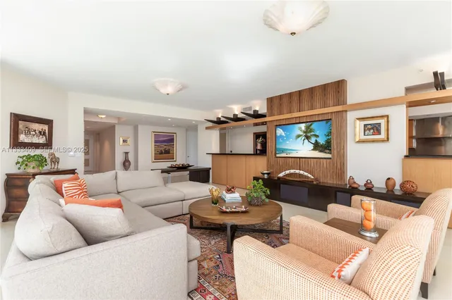 a living room with furniture cabinets and window