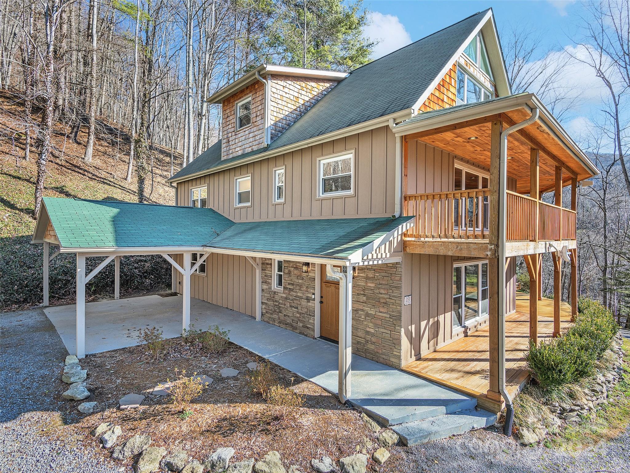 251 Jade Drive Clyde, NC 28721 - Photo 1 of 40 a view of a house with a yard