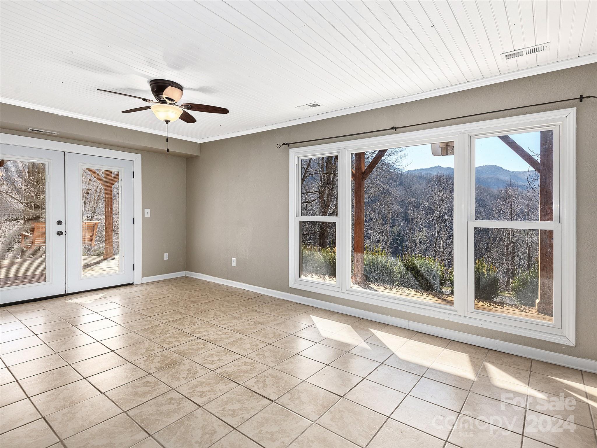 251 Jade Drive Clyde, NC 28721 - Photo 20 of 40 a view of an empty room with a window