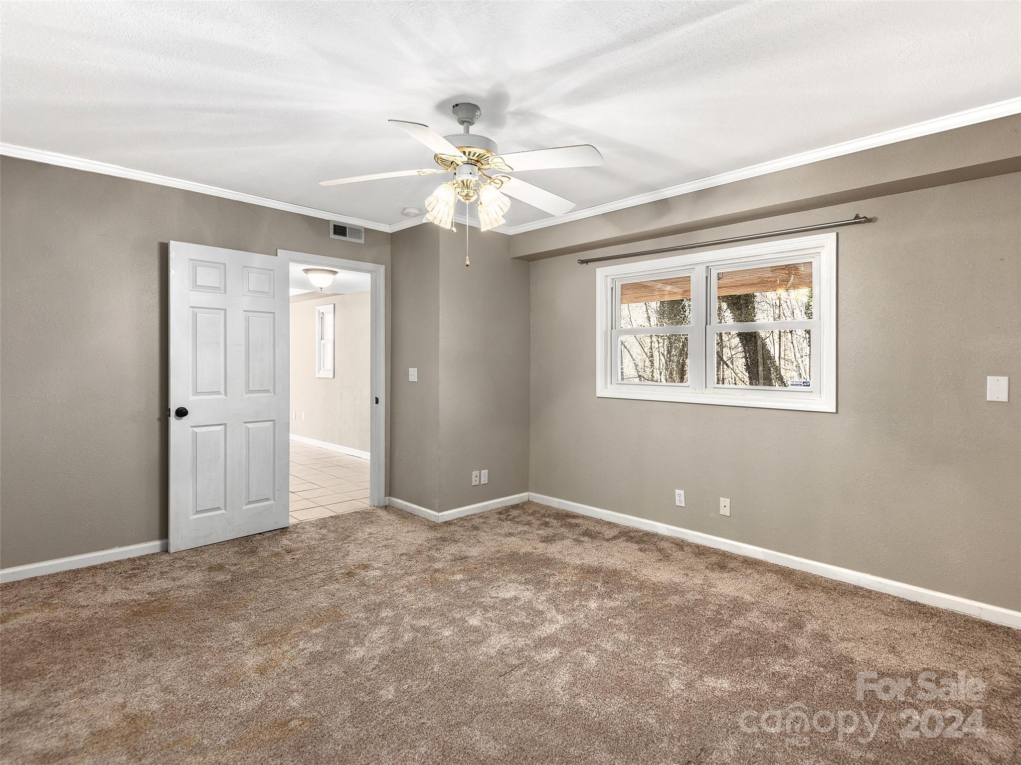 251 Jade Drive Clyde, NC 28721 - Photo 23 of 40 a view of an empty room with a window