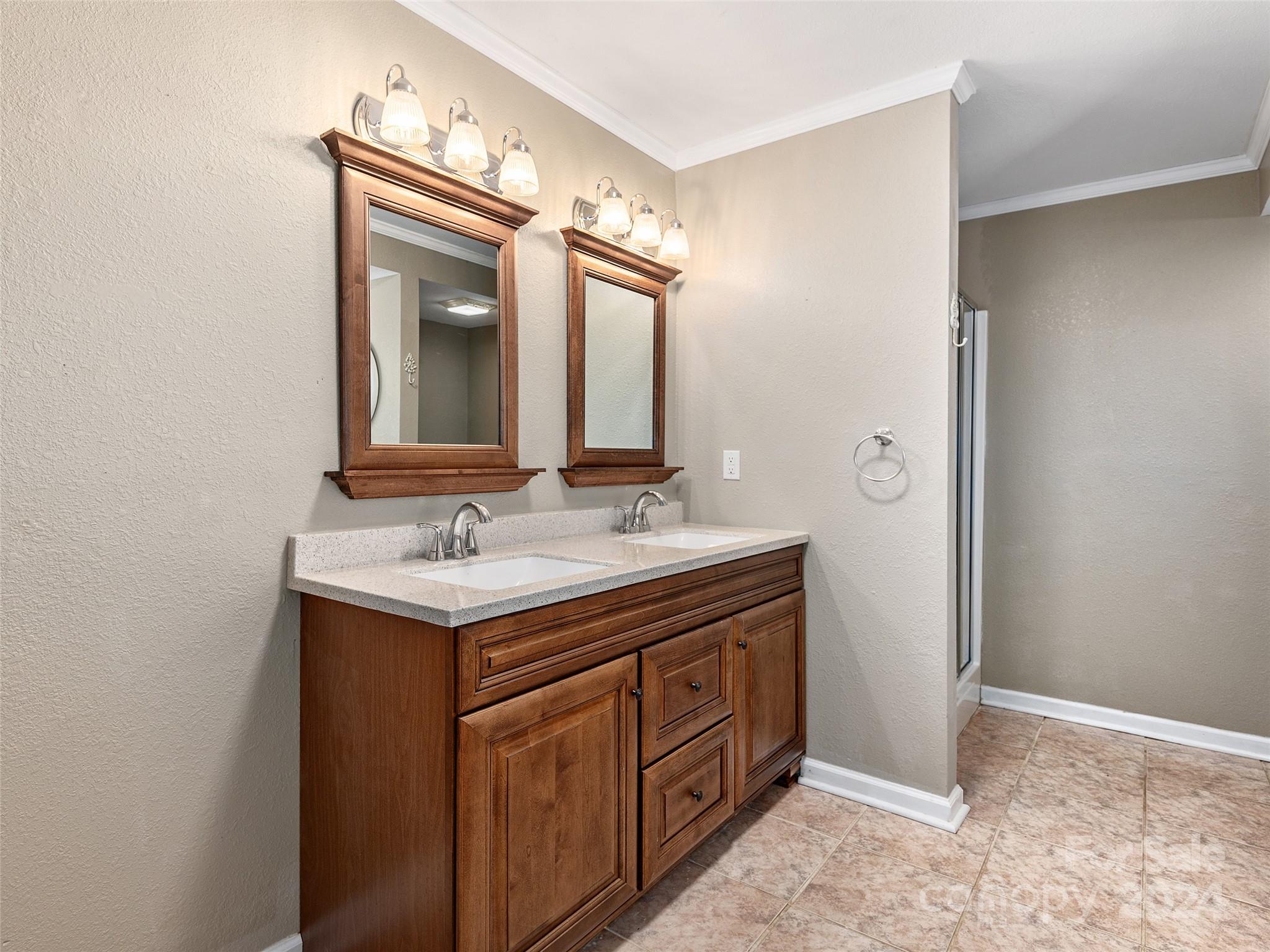 251 Jade Drive Clyde, NC 28721 - Photo 24 of 40 a bathroom with a granite countertop sink and a mirror