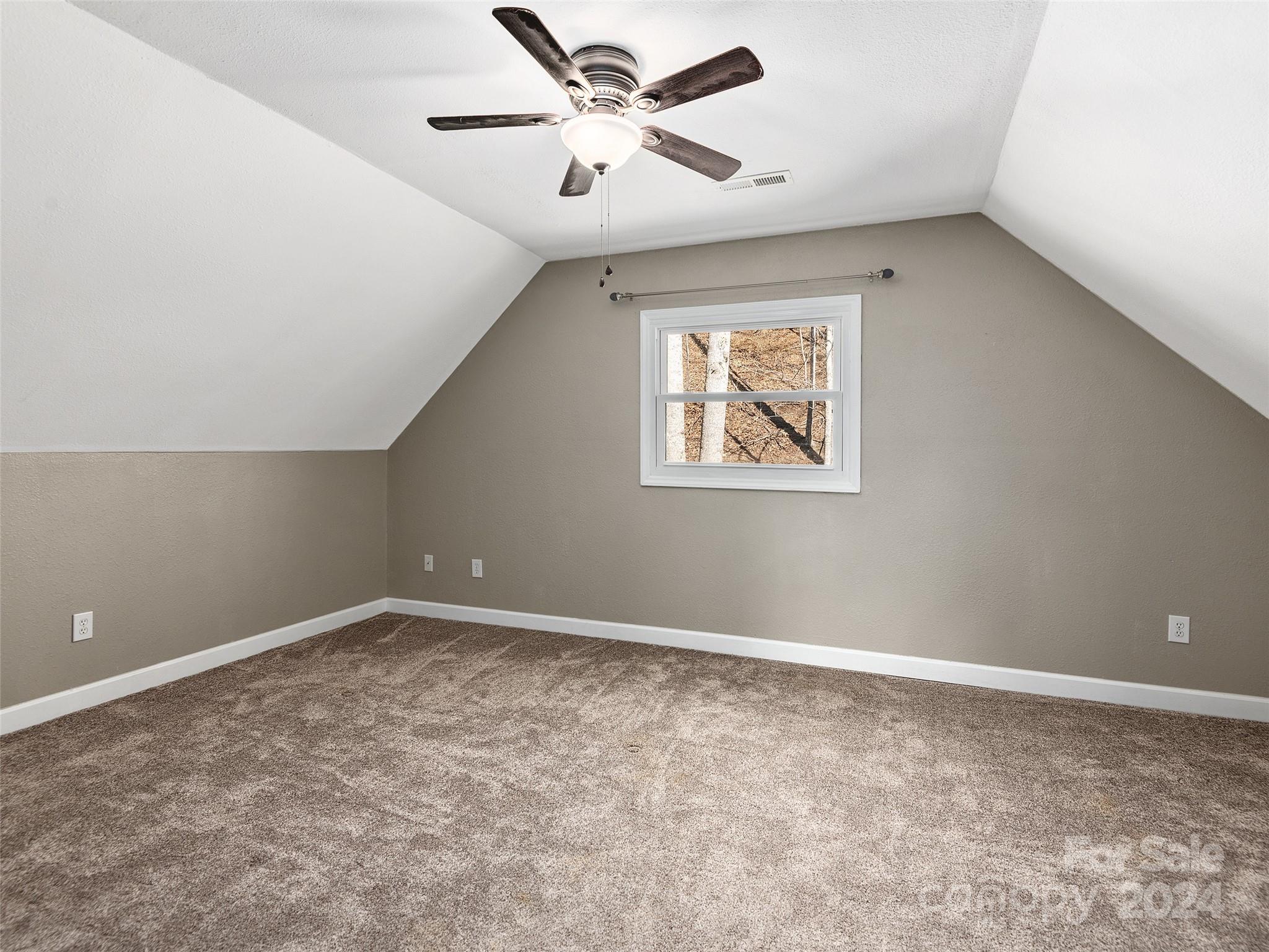 251 Jade Drive Clyde, NC 28721 - Photo 26 of 40 a view of an empty room with a window