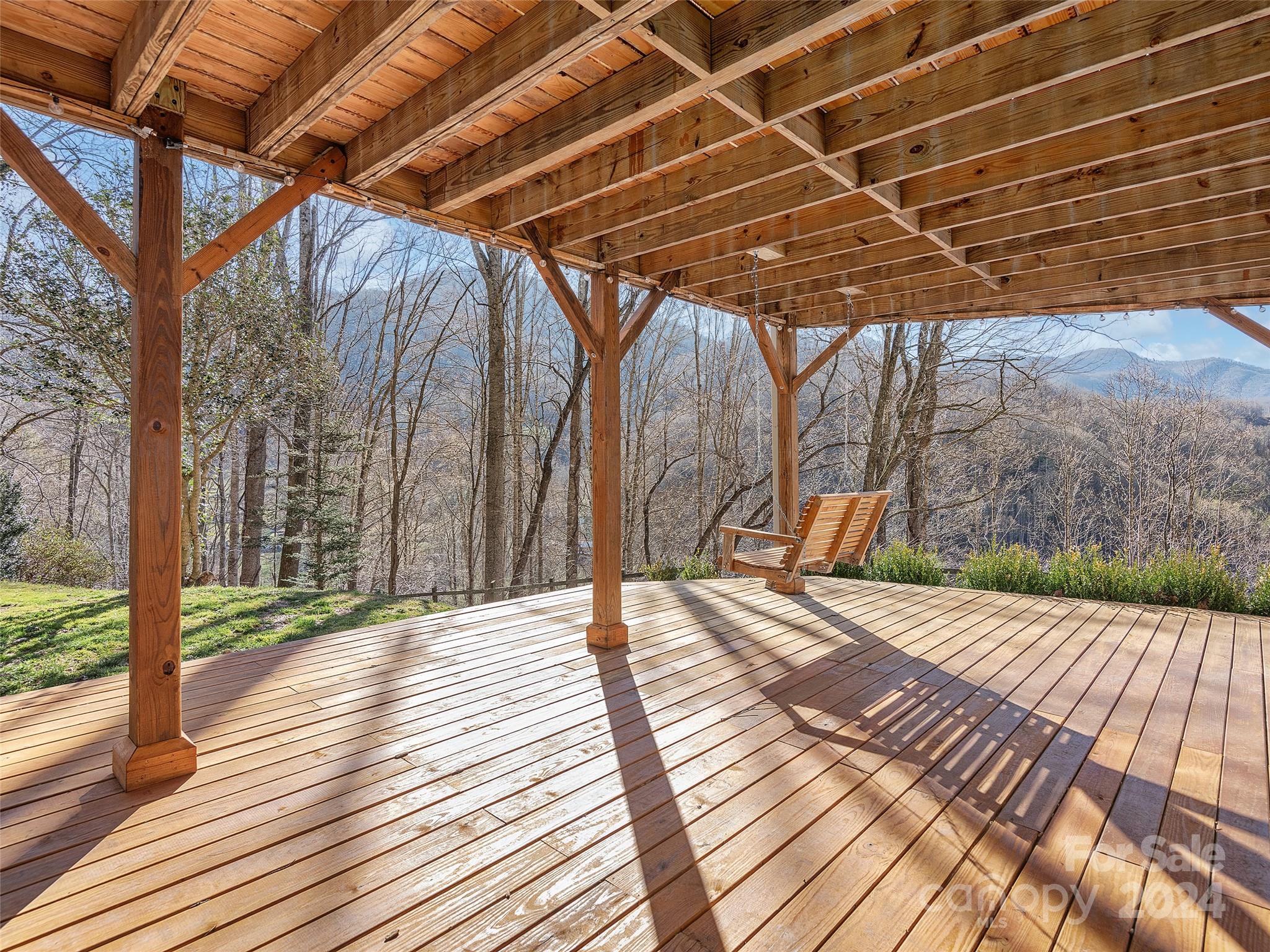251 Jade Drive Clyde, NC 28721 - Photo 32 of 40 a view of backyard with wooden floor
