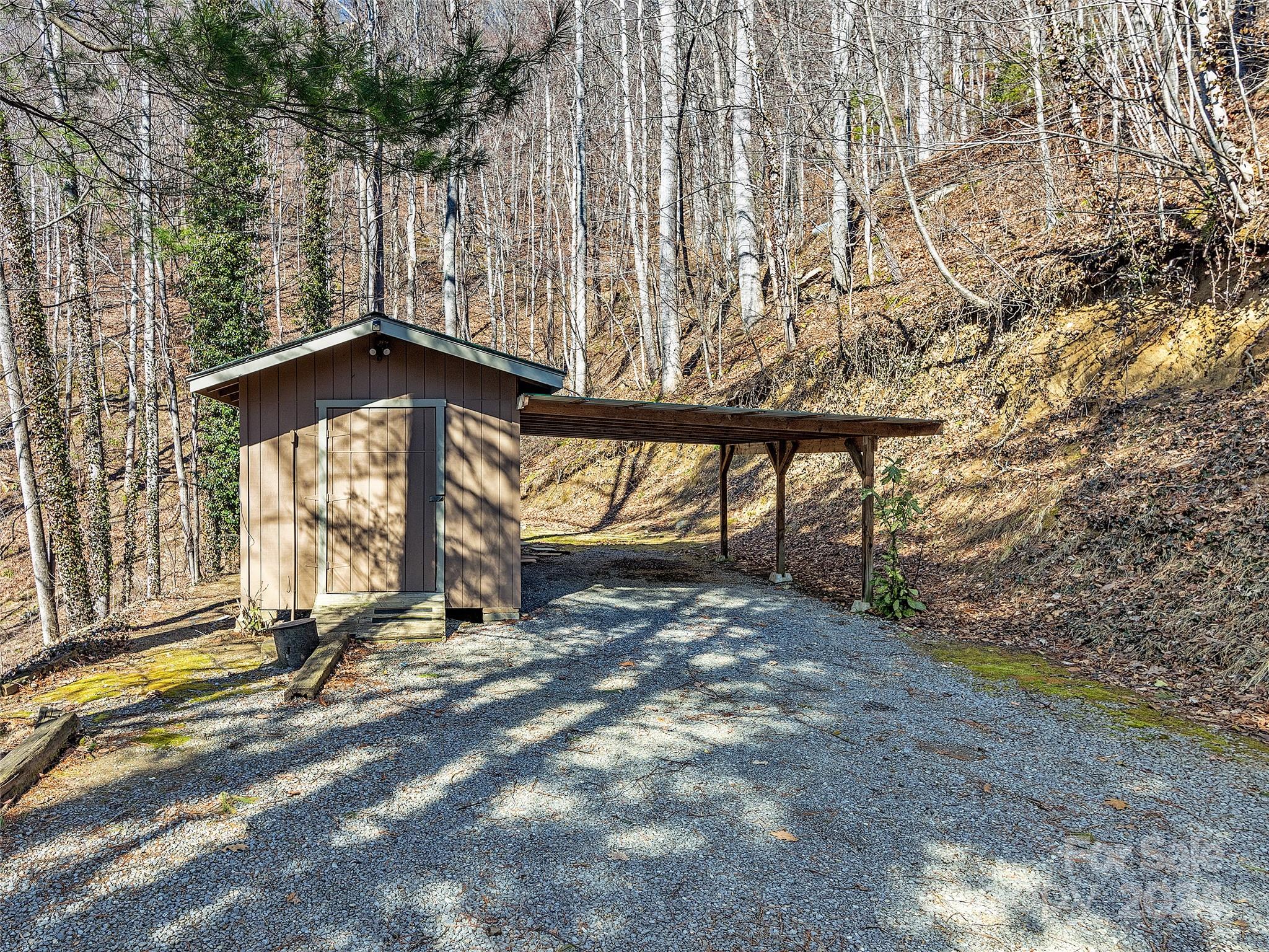 251 Jade Drive Clyde, NC 28721 - Photo 35 of 40 a view of an empty room with a small yard