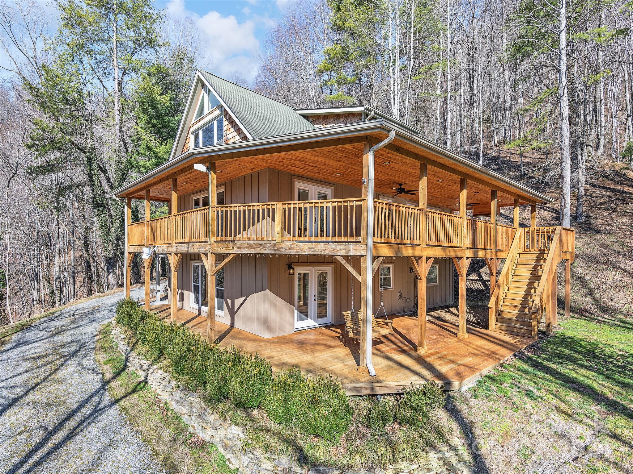 251 Jade Drive Clyde, NC 28721 - Photo 4 of 40 a view of a house with a yard