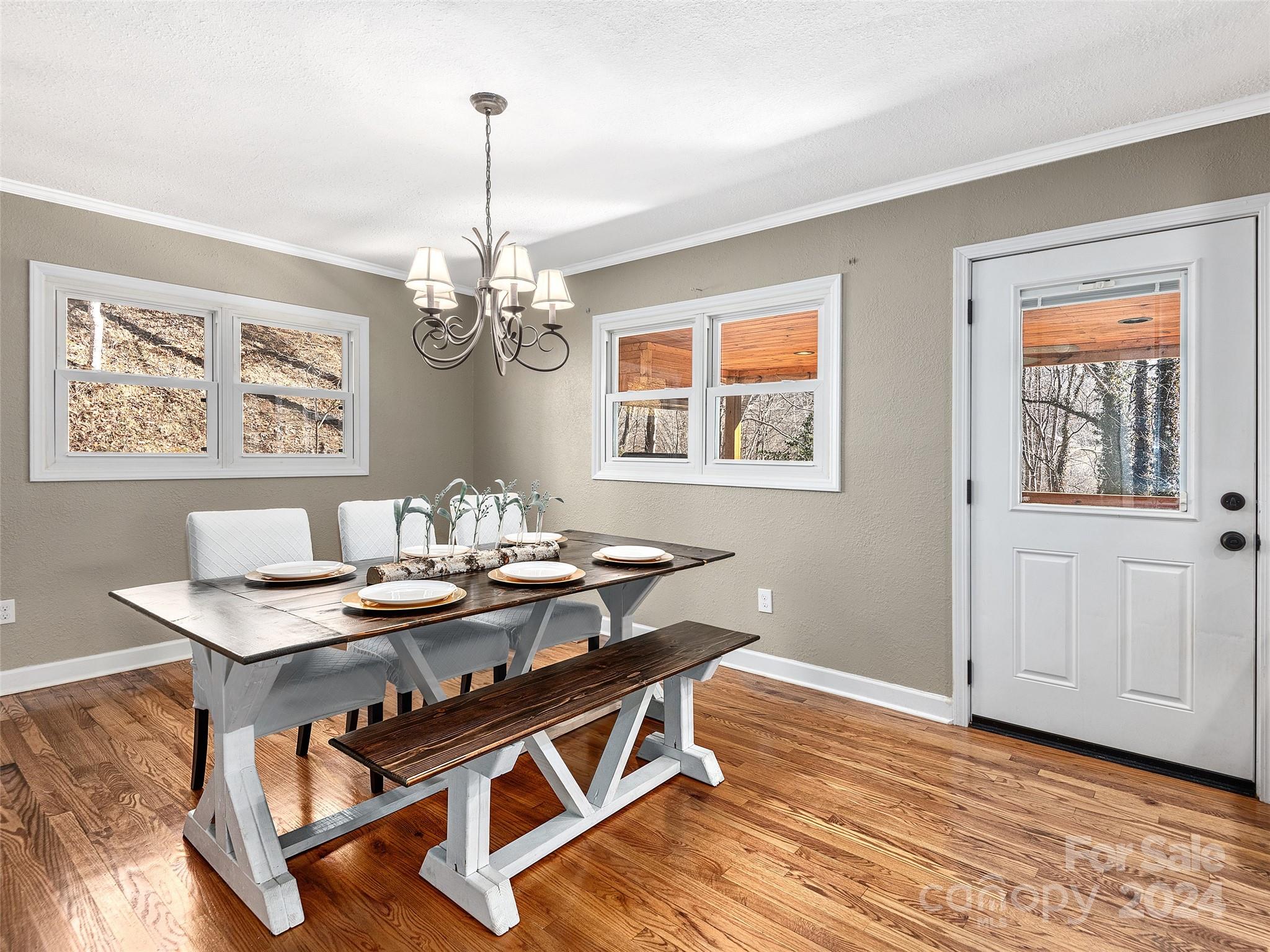 251 Jade Drive Clyde, NC 28721 - Photo 10 of 40 a view of a dining room with furniture window and wooden floor