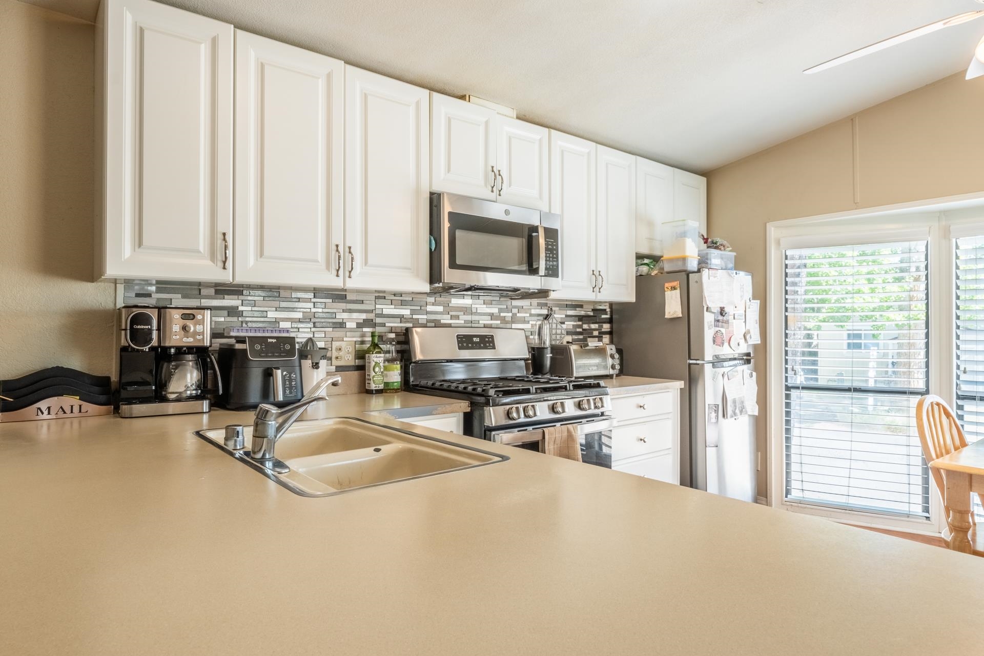 515 South Landing Road Crowley Lake, CA 93546 - Photo 11 of 41 a kitchen with stainless steel appliances a stove a sink a microwave a refrigerator a counter space and cabinets