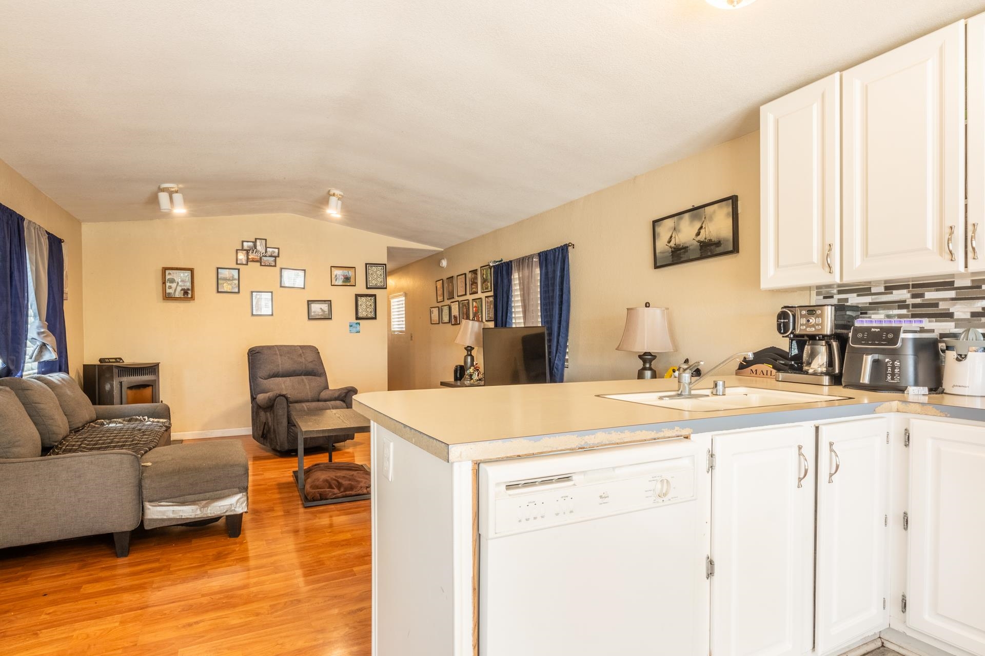 515 South Landing Road Crowley Lake, CA 93546 - Photo 14 of 41 a living room with stainless steel appliances kitchen island granite countertop a sink and white cabinets with wooden floor