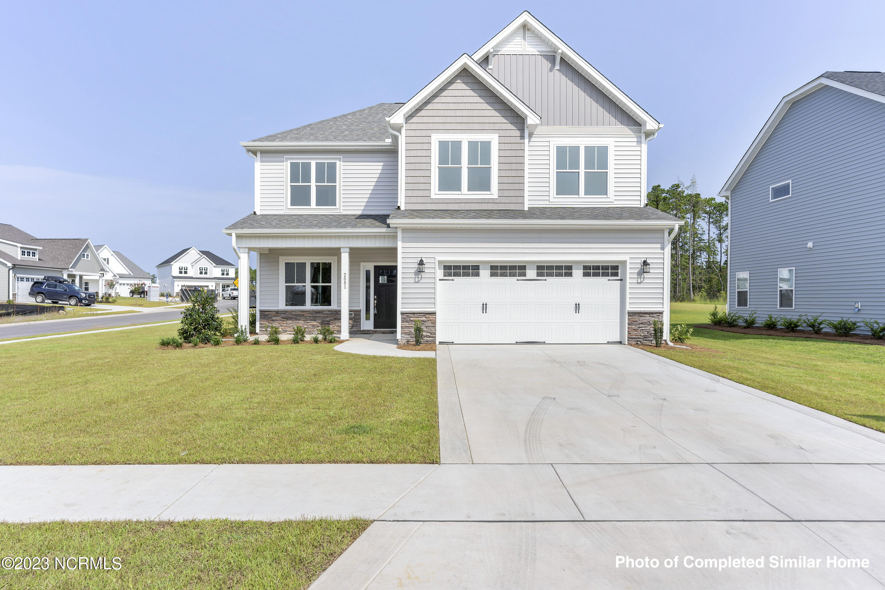 2793 Longleaf Pine Circle Leland, NC 28451 - Photo 2 of 47 Home is under construction. Photos is of completed similar home. Verify selections and finishes with onsite agent.