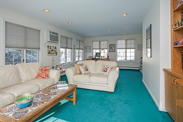 10 Royce Road Newton, MA 02459 - Photo 9 of 24 a living room with furniture and a table