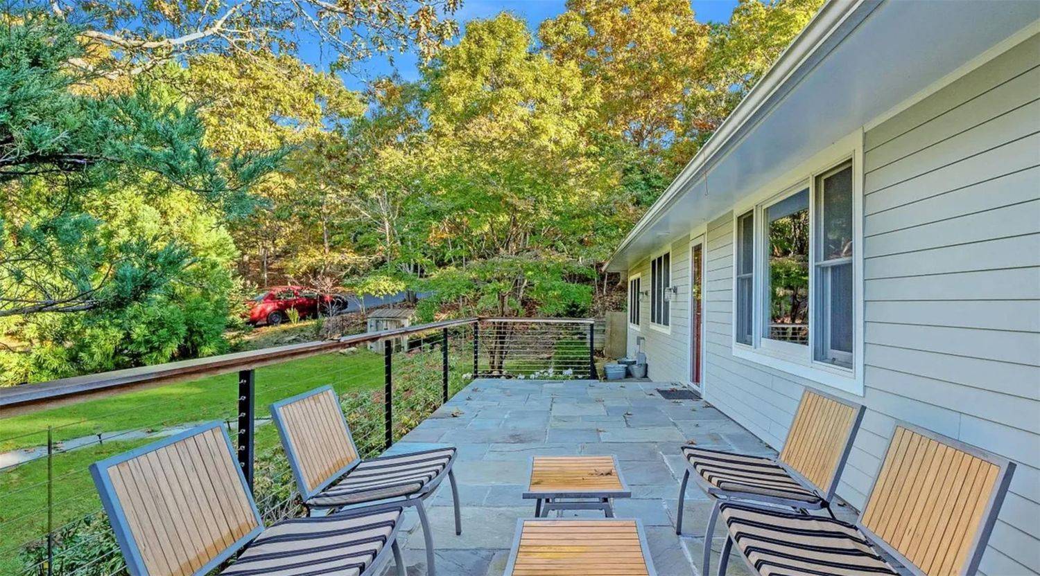2 Captains Walk East Hampton, NY 11937 - Photo 14 of 22 a view of balcony with wooden floor and outdoor seating