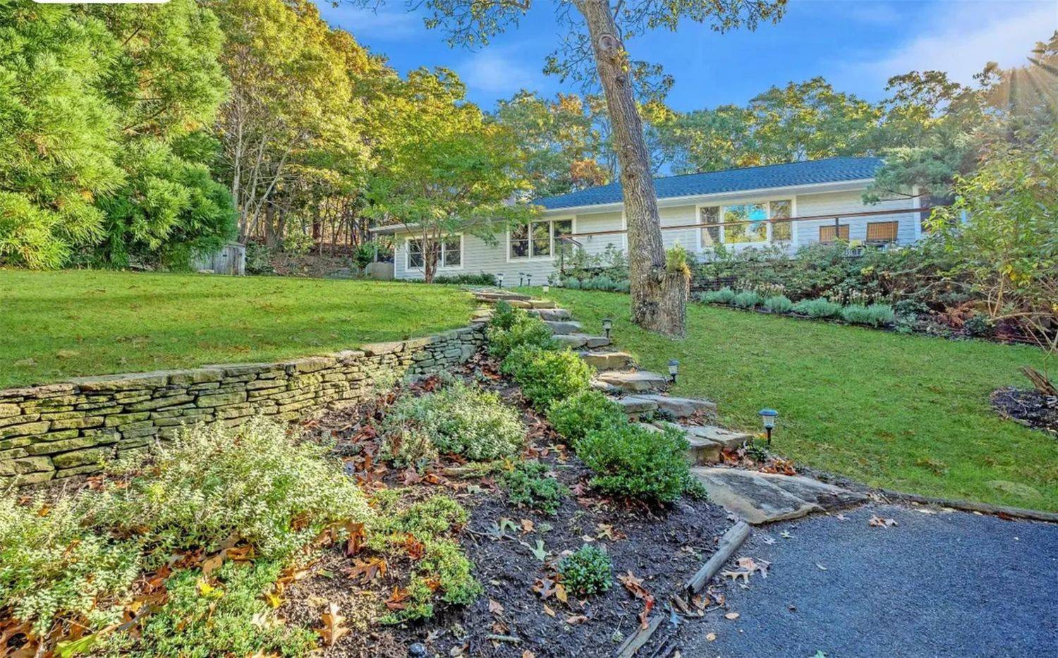 2 Captains Walk East Hampton, NY 11937 - Photo 16 of 22 a view of a house with yard and a garden