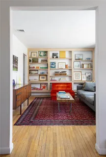 a living room with furniture and a rug