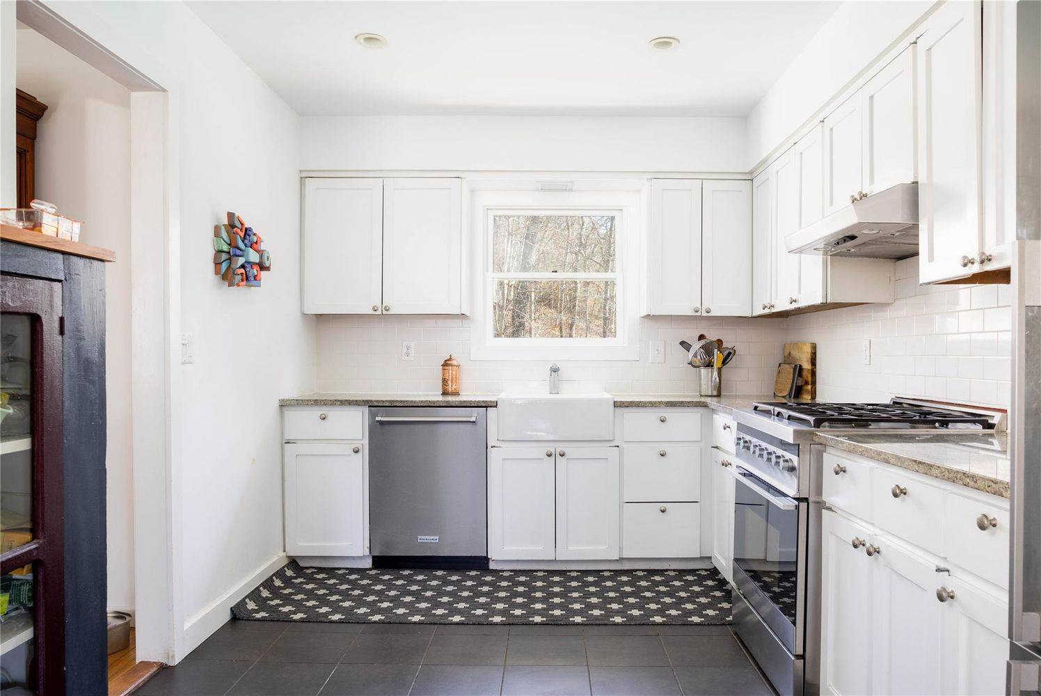 2 Captains Walk East Hampton, NY 11937 - Photo 9 of 22 a kitchen with a cabinets and window