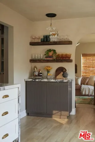 a sink with a potted plant on it