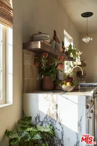 a kitchen with a sink and a stove