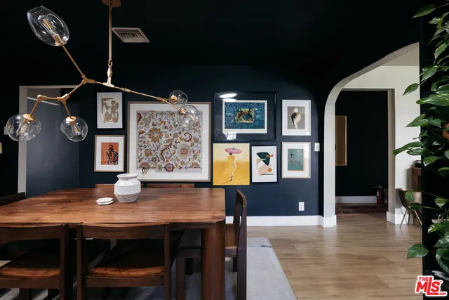 a dining room with furniture and chandelier