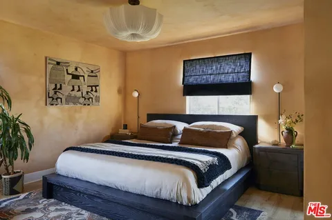 a vase of flowers sitting on a shelf