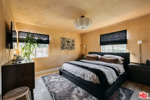 a bathroom with a sink a toilet and shower curtain