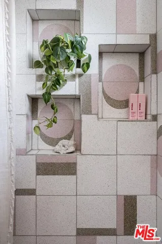 a bathroom with a bathtub and shower