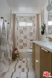 a bathroom with a sink and a shower