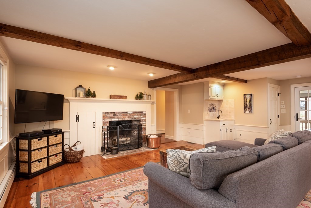 170 Saddle Hill Road Hopkinton, MA 01748 - Photo 12 of 31 a living room with furniture and a flat screen tv