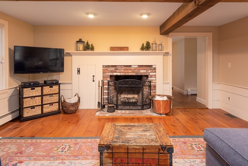 170 Saddle Hill Road Hopkinton, MA 01748 - Photo 15 of 31 a living room with furniture and a flat screen tv