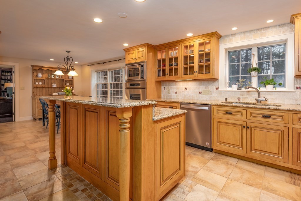 170 Saddle Hill Road Hopkinton, MA 01748 - Photo 2 of 31 a kitchen with stainless steel appliances granite countertop a stove and cabinets