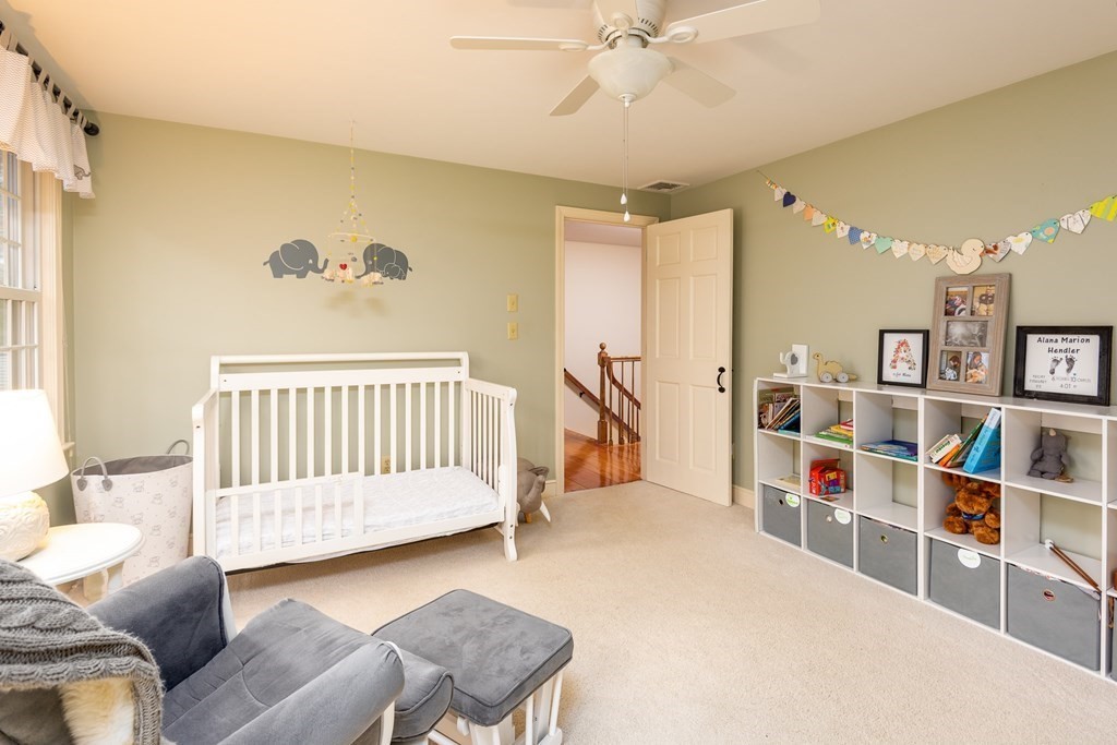 170 Saddle Hill Road Hopkinton, MA 01748 - Photo 21 of 31 a bedroom with furniture and a book shelf
