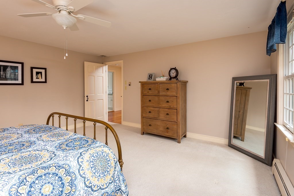 170 Saddle Hill Road Hopkinton, MA 01748 - Photo 24 of 31 a bedroom with a bed and a cabinet