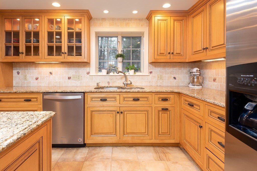 170 Saddle Hill Road Hopkinton, MA 01748 - Photo 3 of 31 a kitchen with stainless steel appliances granite countertop a stove and a sink