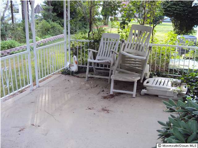 116 Sunset Road Whiting, NJ 08759 - Photo 8 of 21 a view of a deck with a table and chairs with wooden floor and fence