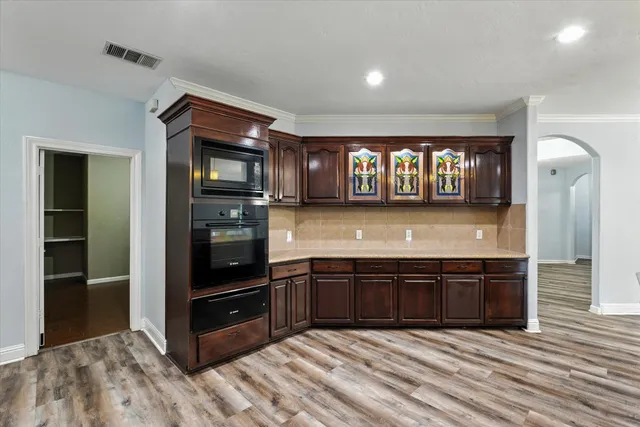 a kitchen with stainless steel appliances granite countertop a stove and a sink