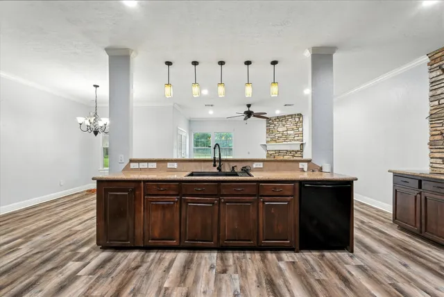 a kitchen with a sink and cabinets
