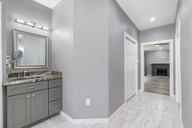 a bathroom with a sink and a mirror