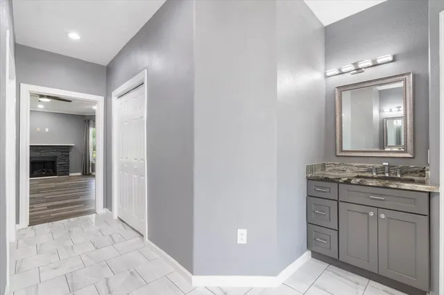 a bathroom with a double vanity sink and mirror