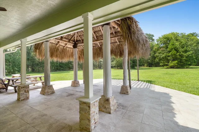 a view of a swimming pool with a patio