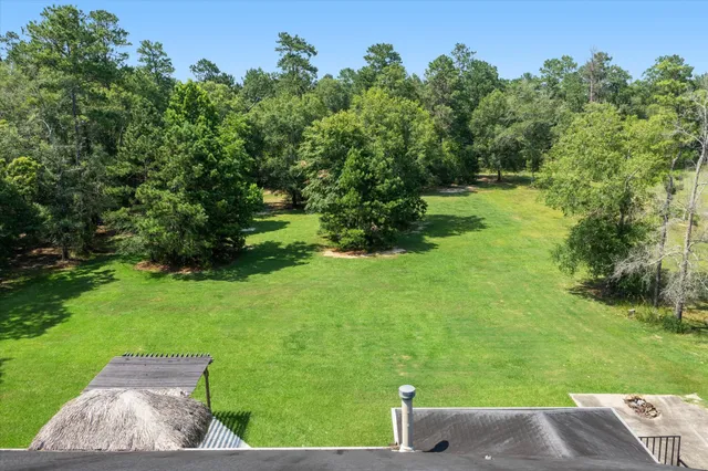 a backyard of a house with lots of green space