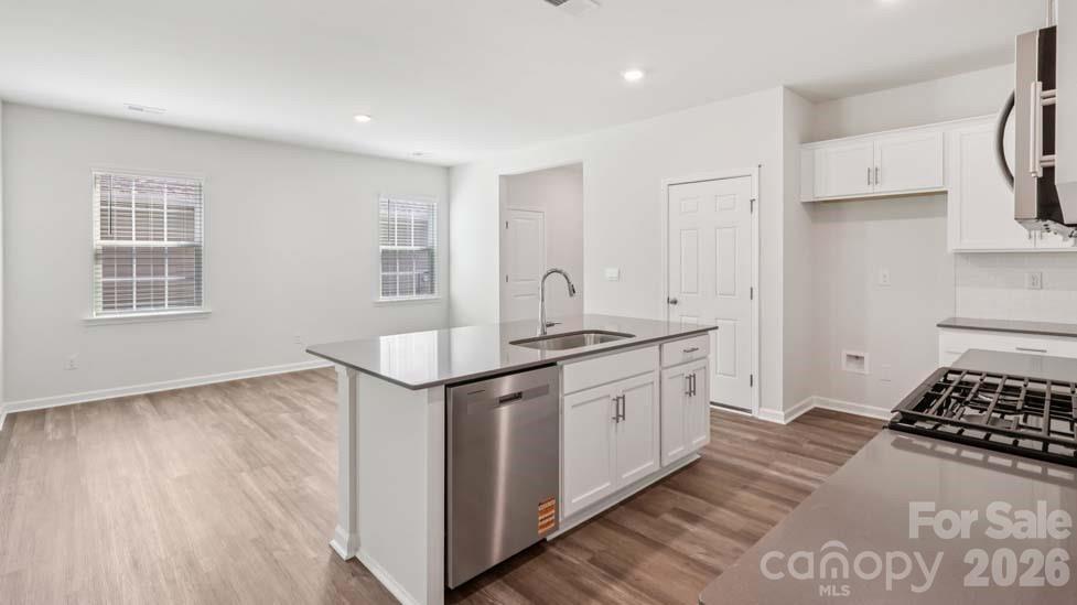 170 Old Home Road Statesville, NC 28677 - Photo 14 of 40 a kitchen with stainless steel appliances granite countertop a sink stove and cabinets