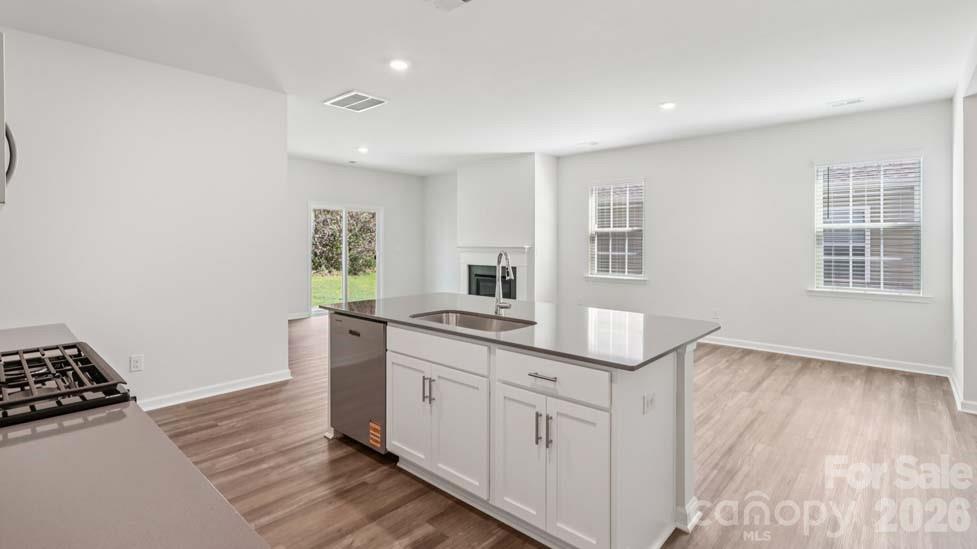 170 Old Home Road Statesville, NC 28677 - Photo 16 of 40 a kitchen with granite countertop a stove and a sink
