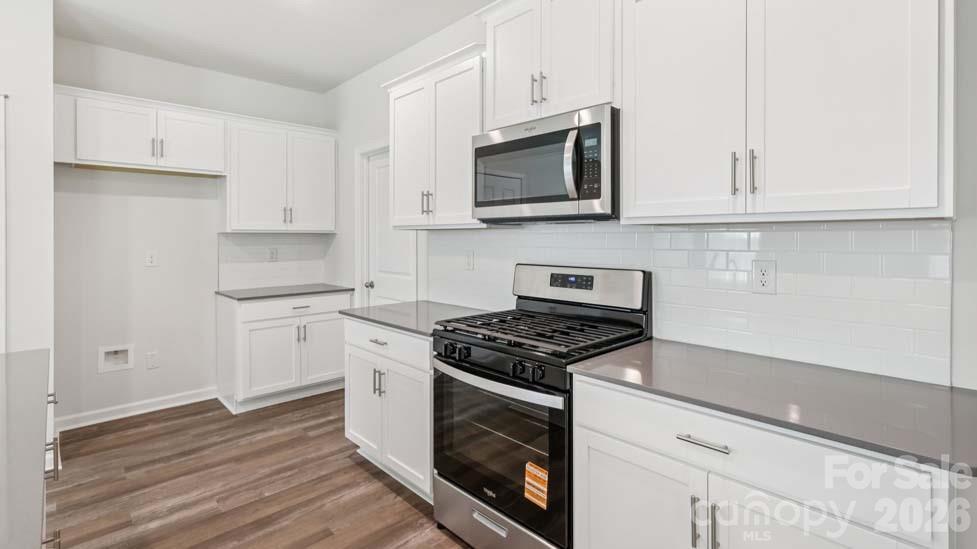 170 Old Home Road Statesville, NC 28677 - Photo 18 of 40 a kitchen with granite countertop white cabinets and stainless steel appliances