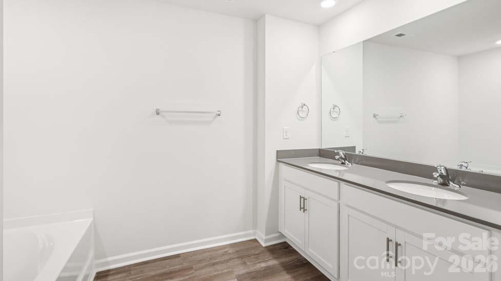 170 Old Home Road Statesville, NC 28677 - Photo 30 of 40 a bathroom with a granite countertop sink and a mirror