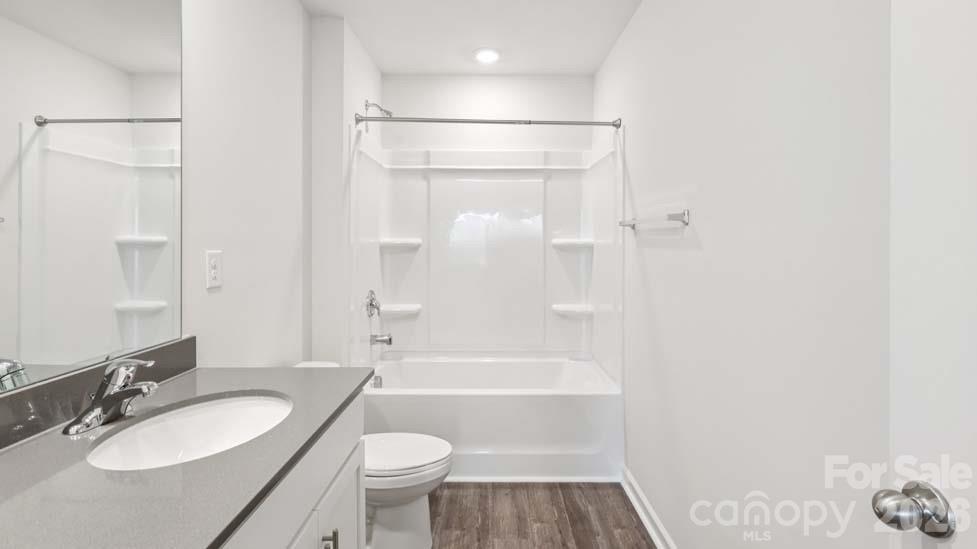 170 Old Home Road Statesville, NC 28677 - Photo 34 of 40 a bathroom with a granite countertop sink toilet and shower