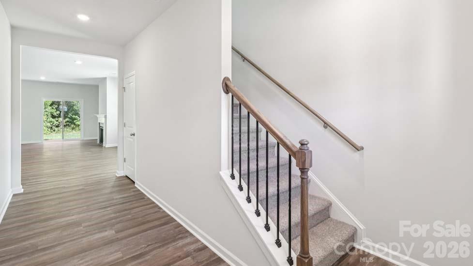 170 Old Home Road Statesville, NC 28677 - Photo 8 of 40 a view of a hallway with wooden floor and staircase