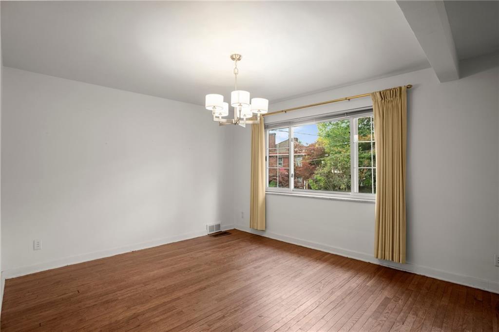 3323 Shady Ave Extension Pittsburgh, PA 15217 - Photo 11 of 45 a view of a room with wooden floor and large window