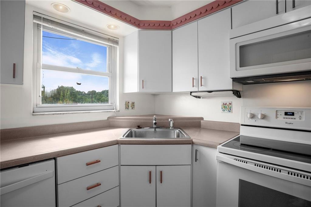 3323 Shady Ave Extension Pittsburgh, PA 15217 - Photo 17 of 45 a kitchen with a sink stove and microwave