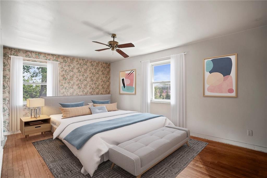 3323 Shady Ave Extension Pittsburgh, PA 15217 - Photo 18 of 45 a bedroom with a large bed and a window