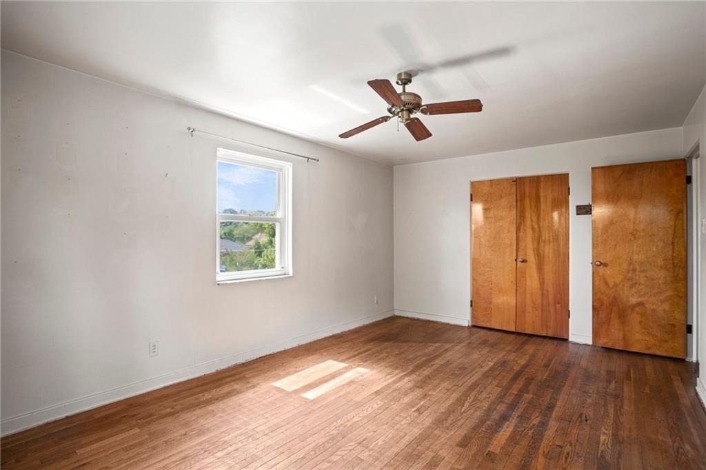 3323 Shady Ave Extension Pittsburgh, PA 15217 - Photo 19 of 45 a view of empty room with wooden floor and fan