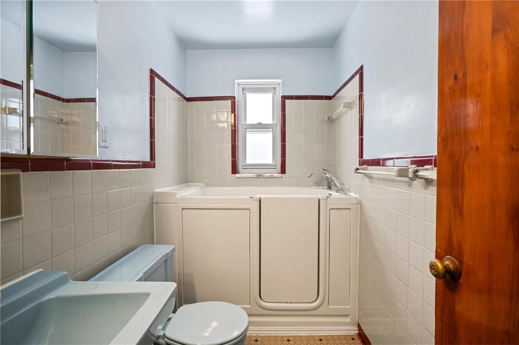3323 Shady Ave Extension Pittsburgh, PA 15217 - Photo 21 of 45 a bathroom with a granite countertop toilet sink and mirror