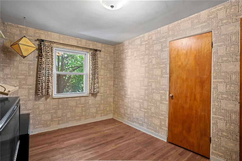 3323 Shady Ave Extension Pittsburgh, PA 15217 - Photo 25 of 45 an empty room with wooden floor and windows